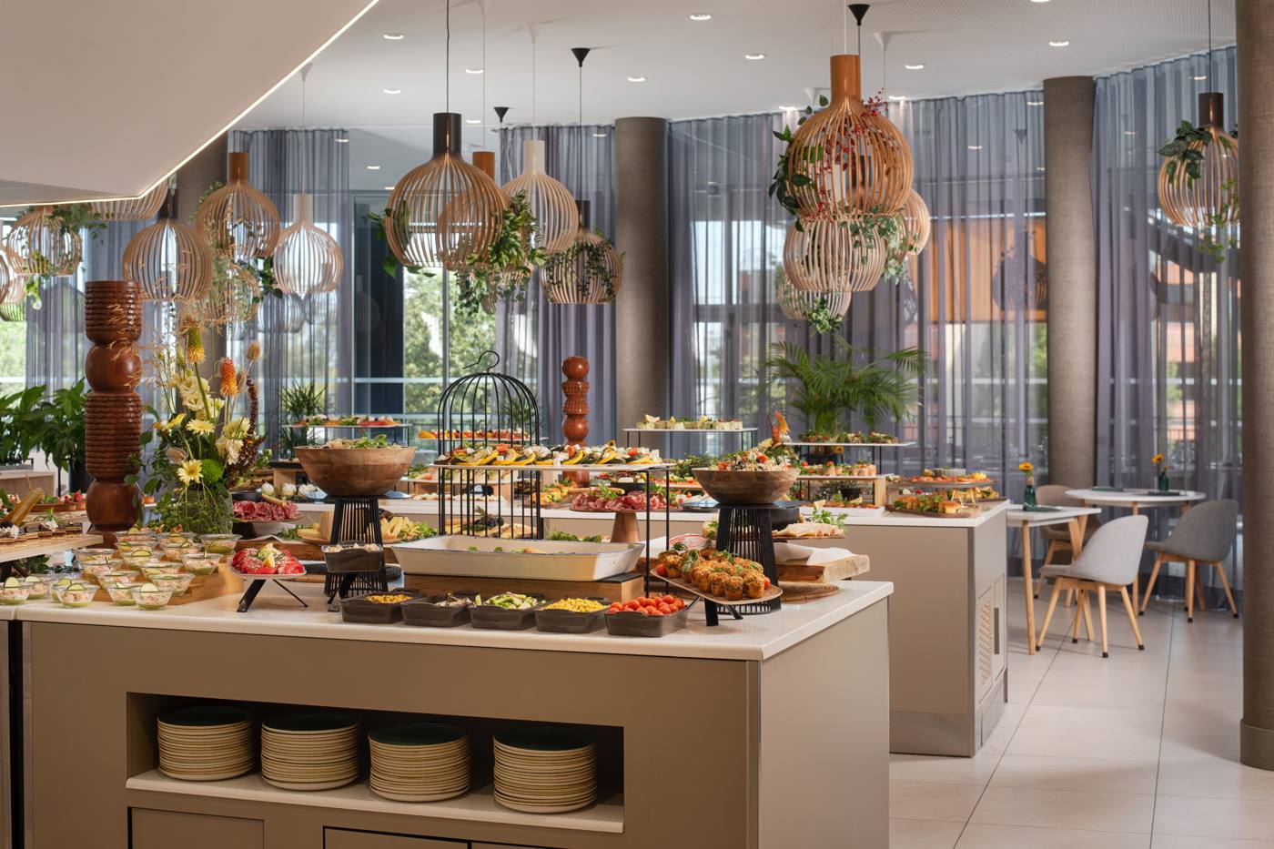 The buffet under the wooden pendant lights